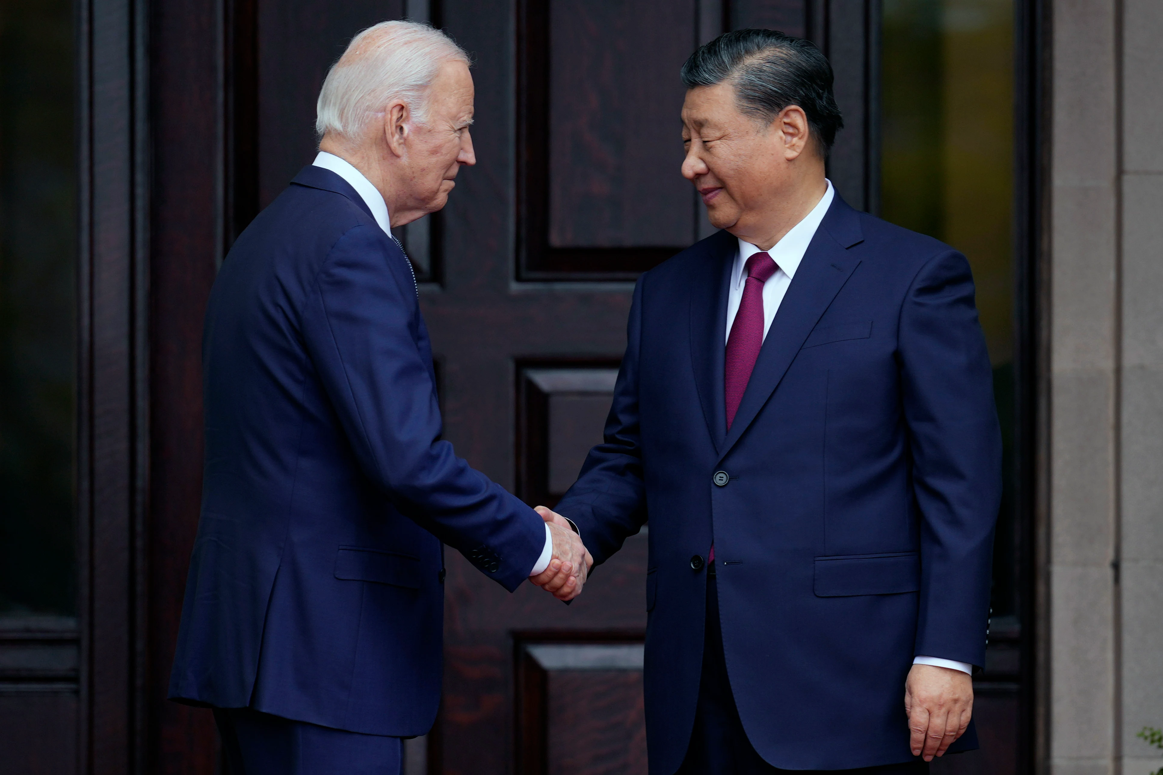 President Joe Biden greets China's President President Xi Jinping at the Filoli Estate in Woodside, Calif.