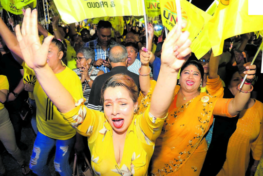 UNC supporters celebrate the party’s victory in the General Election at their headquarters in Chaguanas last night. PHOTO BY KRISTIAN DE SILVA