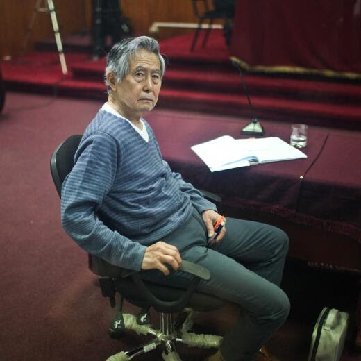 (FILES) Peru's former president (1990-2000), Alberto Fujimori, who faces trial on charges that he funneled public money to tabloid newspapers who duly lambasted opponents during his brutal tenure, appears in court for a hearing in Lima, on November 07, 2013. Former Peruvian President Alberto Fujimori, who was released from prison on December 2023 under a humanitarian pardon, died on September 11, 2024, at the age of 86 at his home in Lima, where he was recovering from radiotherapy treatment for cancer, his family said. (Photo by Ernesto BENAVIDES / AFP)