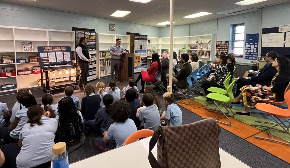 Students, EPA staff, grantees, and school district leadership in a library