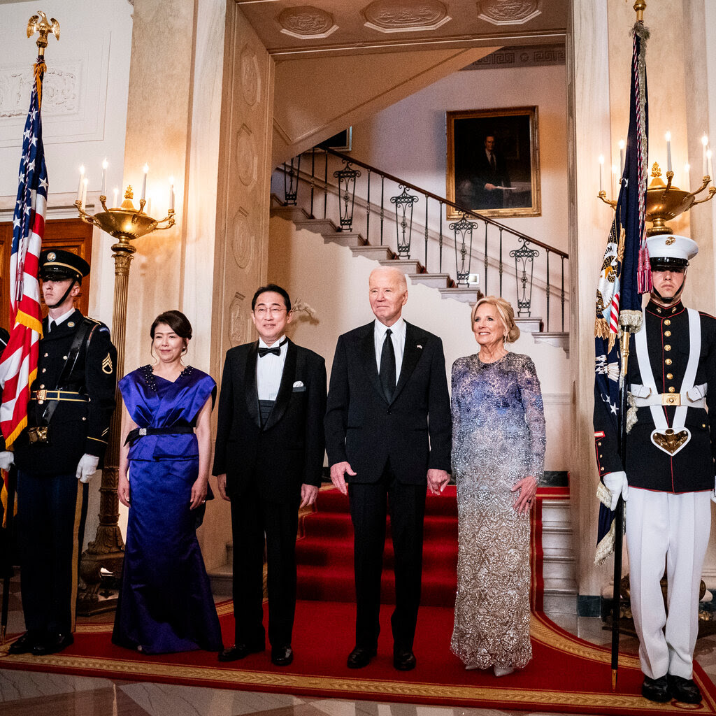 President Biden and Prime Minister Fumio Kishida stand with their wives.