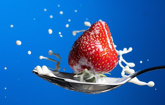 milk, strawberry and spoon