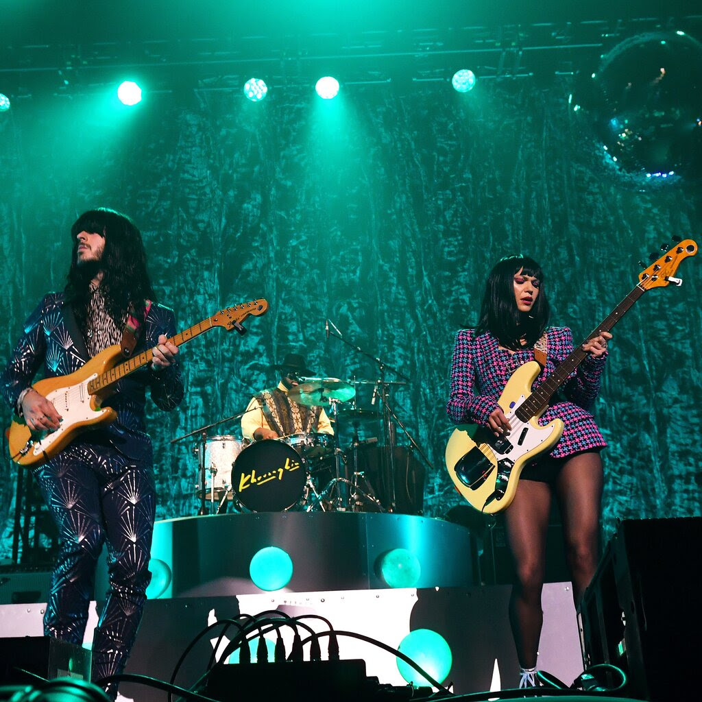Khruangbin onstage during a concert in London.