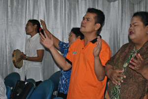 Believers are singing in worship together.