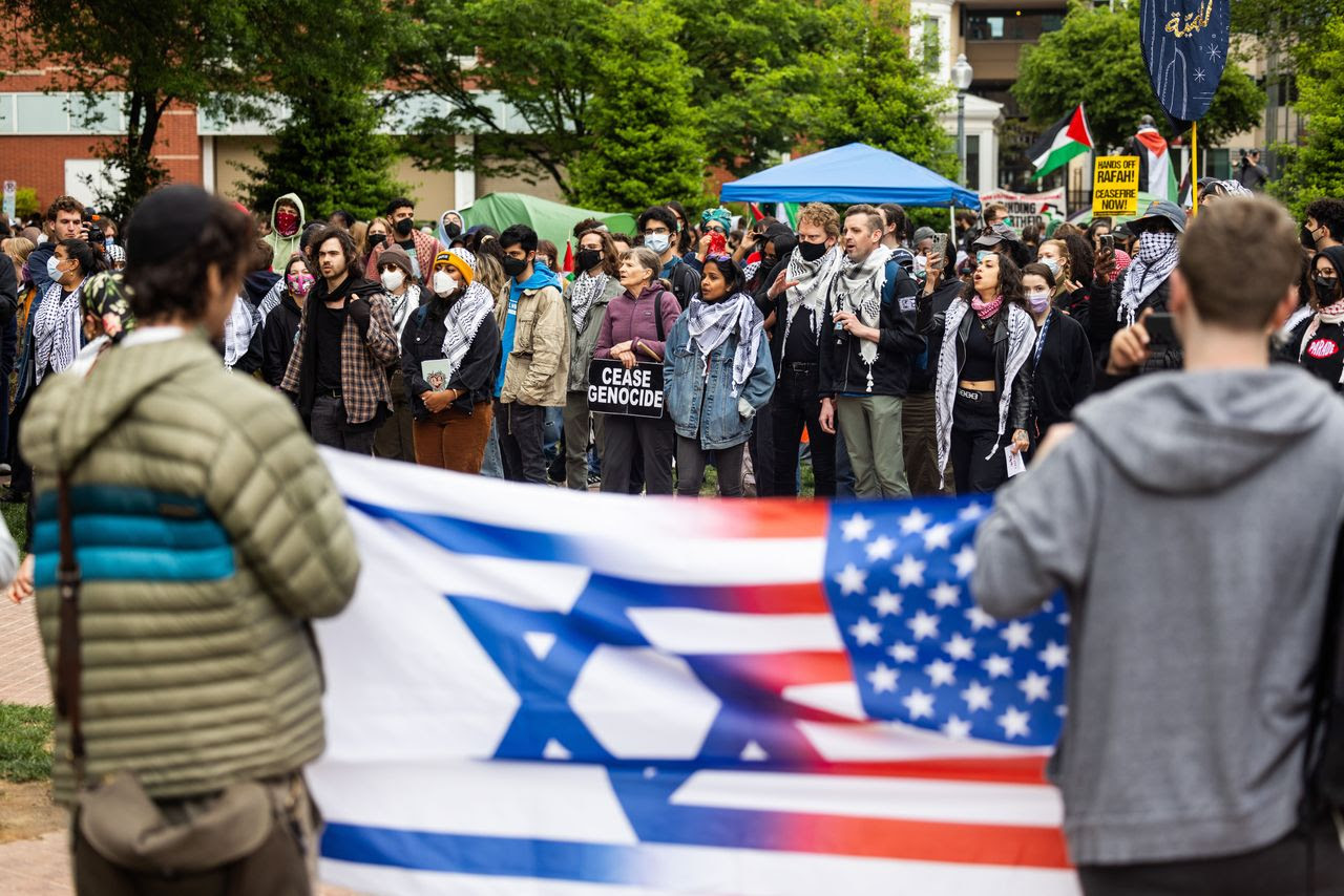 Two people display a flag amid a pro-Palestinian demonstration last week at George Washington University in Washington, D.C. (Jim Lo Scalzo/EPA-EFE/Shutterstock)