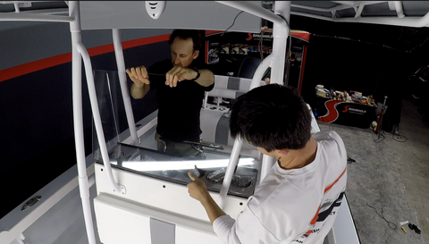 Two Men Installing Boat Windshield