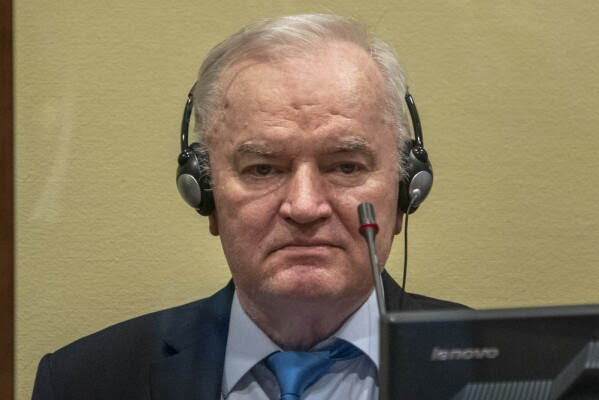 FILE - Former Bosnian Serb military chief Ratko Mladic sits in the court room in The Hague, Netherlands, Tuesday, June 8, 2021, where the United Nations court delivers its verdict in the appeal of Mladic against his convictions for genocide and other crimes and his life sentence for masterminding atrocities throughout the Bosnian war. (Jerry Lampen/Pool via AP, File)
