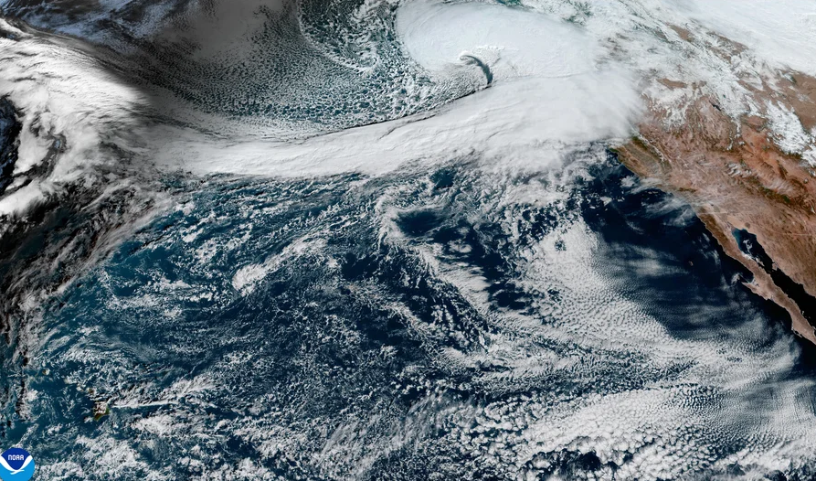 Satellite image of the Pacific Ocean, showing a large weather system moving to California