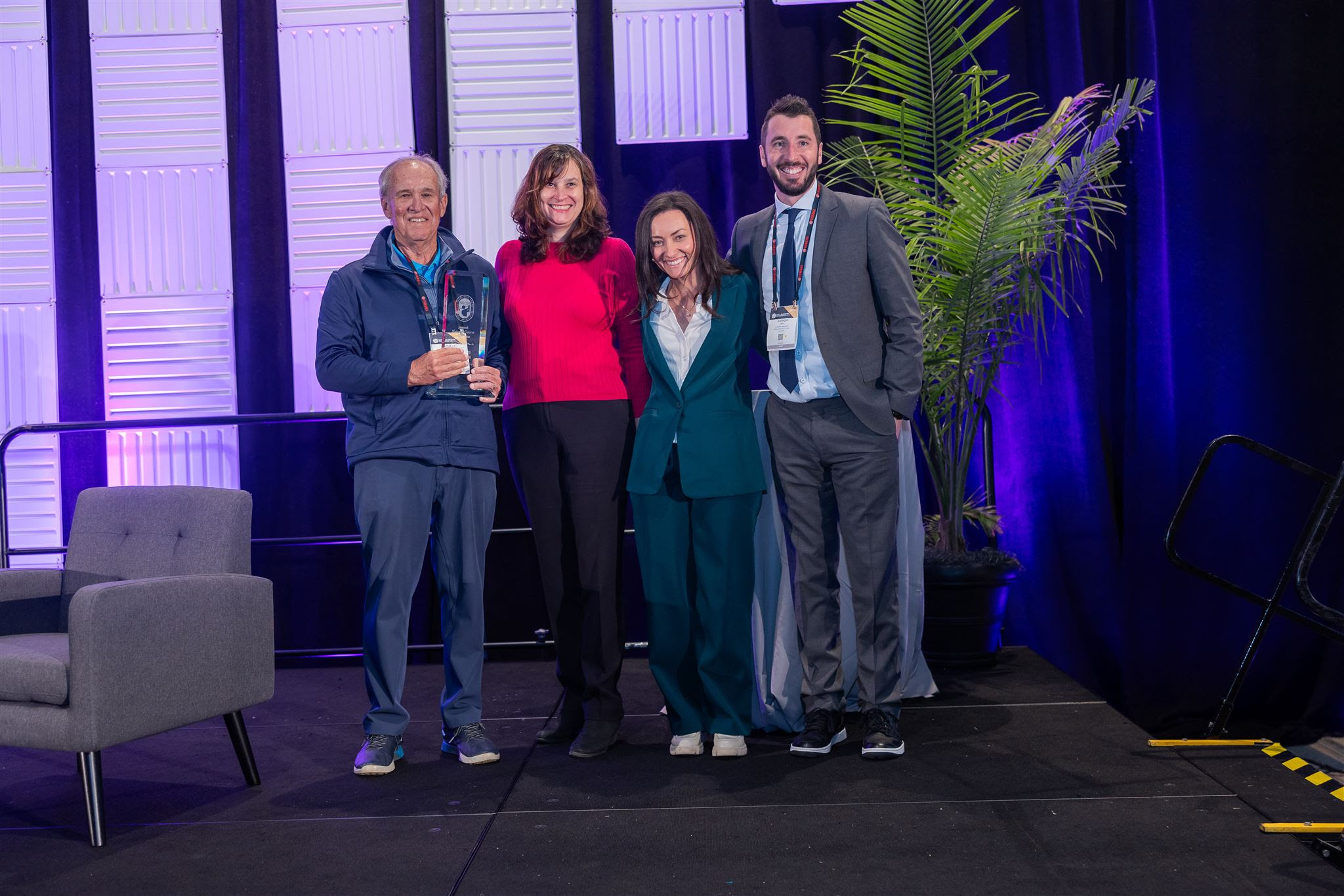 Elgison (left) receives the NGCOA Golf Course of the Year from Katherine Jemsek (second from left) with Jones and Deal also on hand to accept the honor.