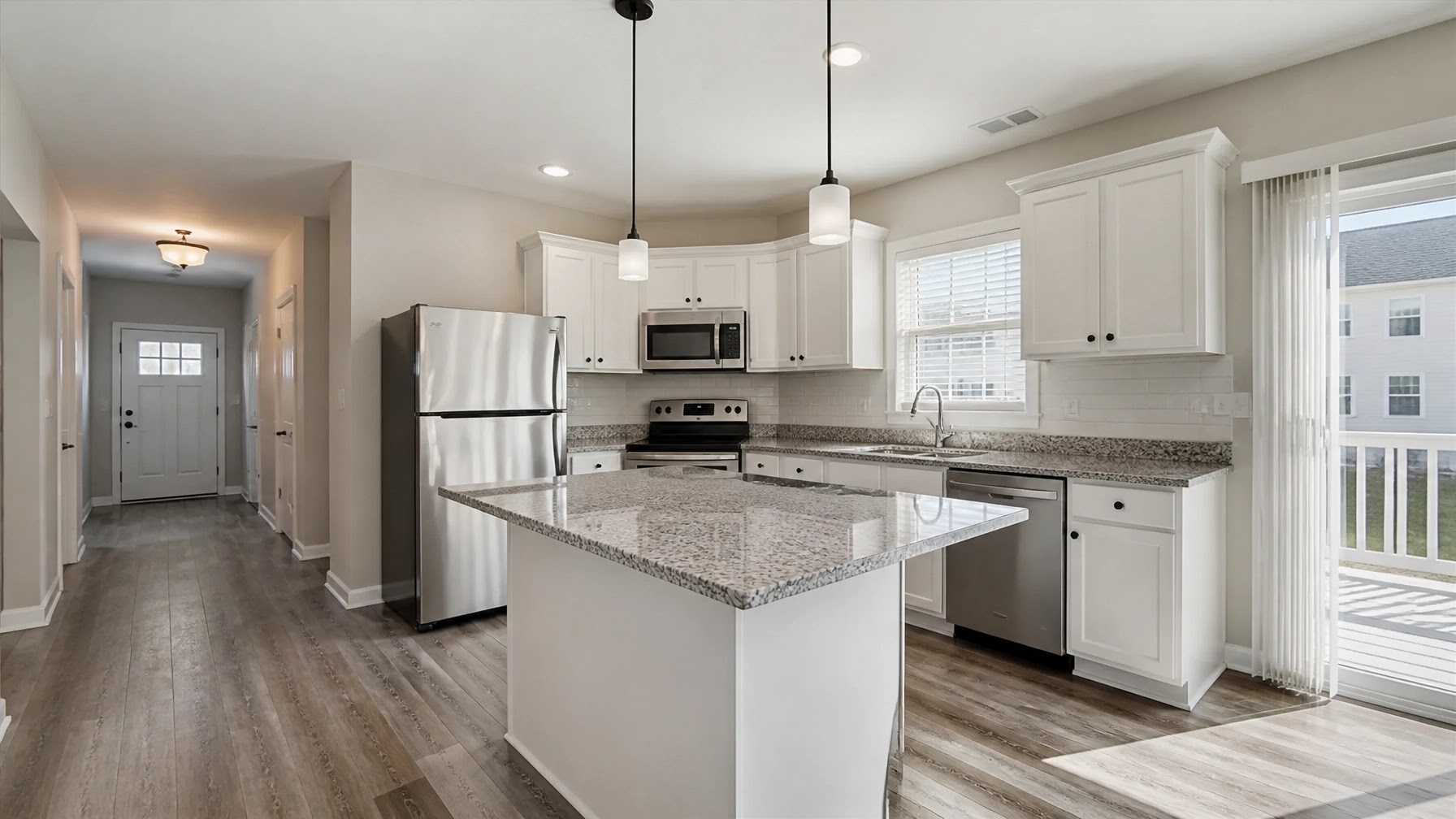 Clean, well-maintained rental kitchen with neutral tones and modern appliances