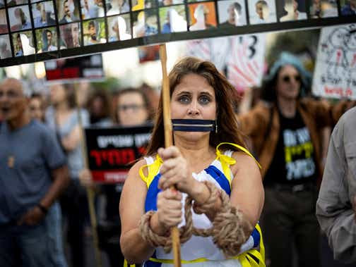 People take part in a protest demanding the immediate release of hostages kidnapped by Hamas on October 7, in Tel Aviv on Thursday.