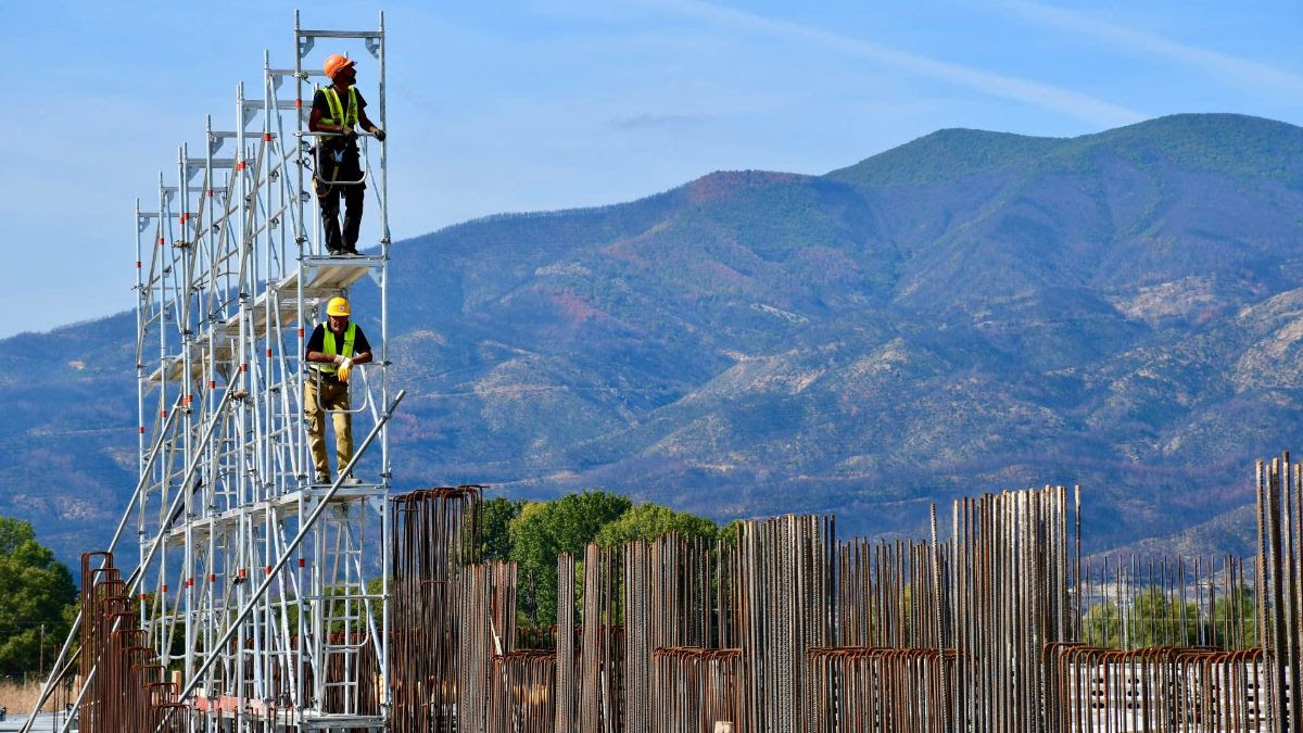 Construction workers on scaffolding at the SNF General Hospital of Komotini.