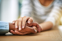 holding hands at table