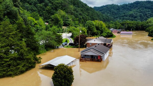 Catastrophic flash floods killed dozens of people in eastern Kentucky in July 2022. Here, homes in Jackson, Ky., are flooded with water.