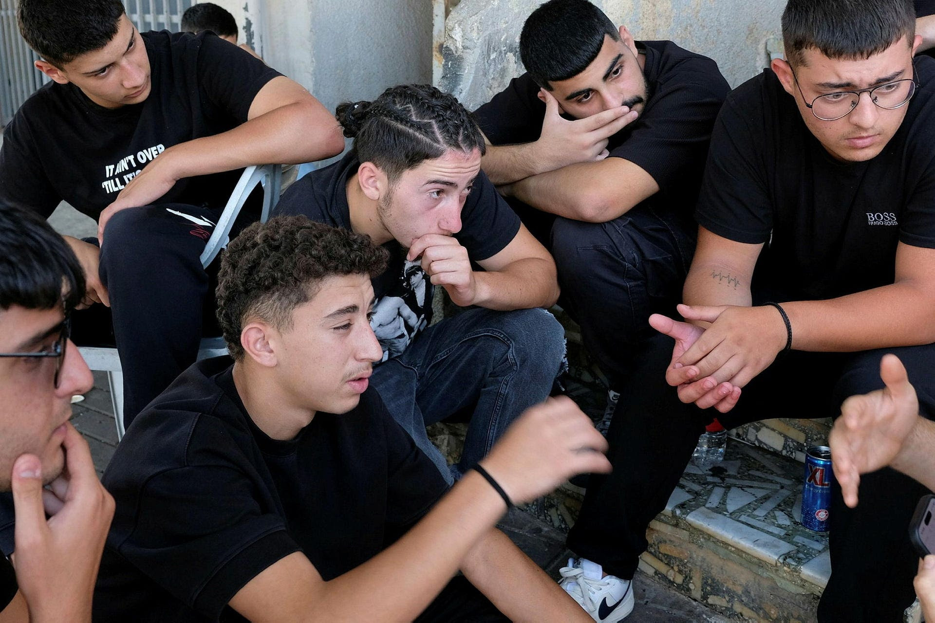 Teenagers mourn the death of the 12 Druze children killed by a rocket strike in Majdal Shams, Sunday.