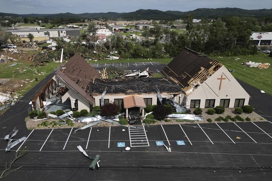 An overhead view of a church that was damaged by a severe storm.
