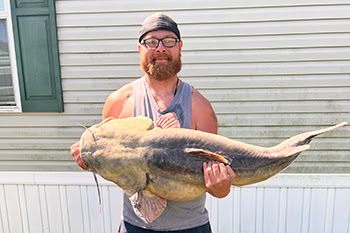 Codie Carlson was bowfishing Plum Creek on Sunday, June 29, when he brought in a new state-record flathead catfish.