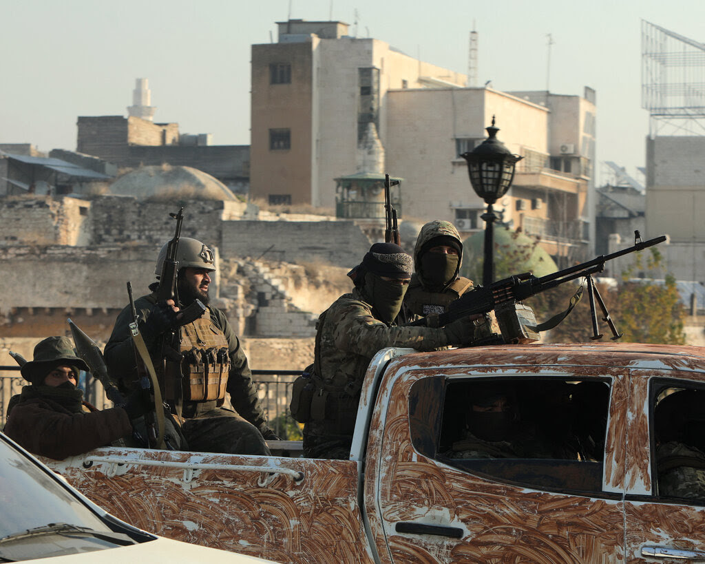 Fighters in the back of a painted pickup truck.