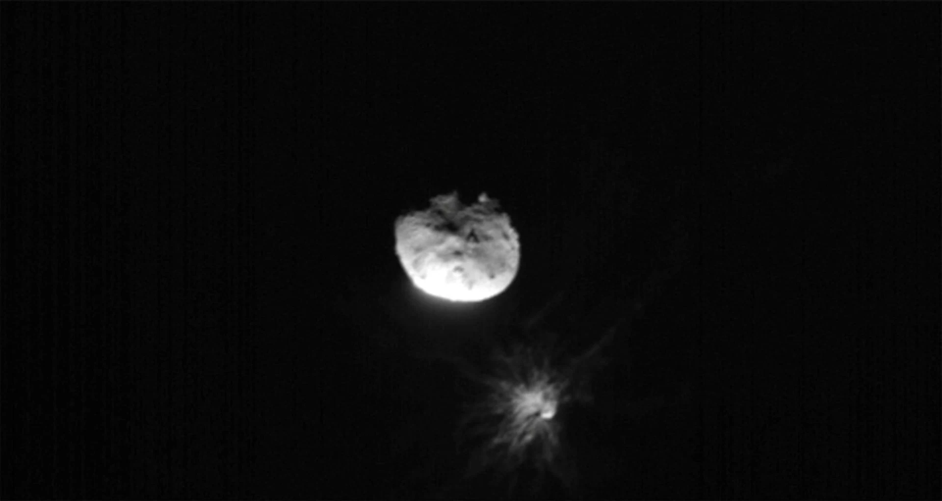 View of Didymos, Dimorphos, and the plume coming off of Dimorphos after the Double Asteroid Redirect Test, or DART mission, purposefully made impact, in this image acquired by ASI's LICIACube satellite just before its closest approach to the Dimorphos asteroid, September 26, 2022.