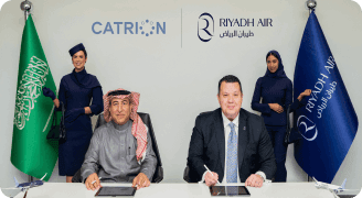 Riyadh Air and Catrion representatives signing a strategic agreement at an official ceremony.