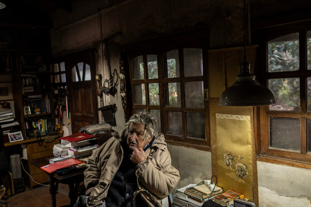 Mr. Mujica sitting in his house. 