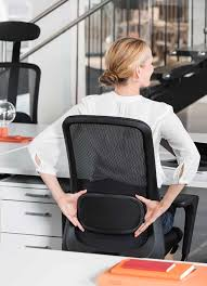 A young girl seated on a modern ergonomic chair with built-in lumbar support, focused on a task at her desk. The chair is designed to enhance comfort and support the lower back, ensuring proper posture while working or studying."