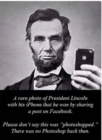 Abe Lincoln using an iPhone.