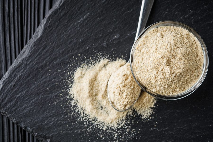 Spoon and cup with asafoetida powder