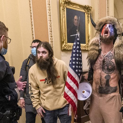 FILE - Supporters of President Donald Trump, including Jacob Chansley, right with fur hat, are confronted by U.S. Capitol Police officers outside the Senate Chamber inside the U.S. Capitol, Jan. 6, 2021, in Washington. Chansley, the spear-carrying rioter whose horned fur hat, bare chest and face paint made him one of the more recognizable figures in the Jan. 6, 2021, assault on the Capitol, apparently aspires to be a member of Congress. Online paperwork shows that Chansley filed a candidate statement of interest, Thursday, Nov. 9, 2023, indicating he wants to run as a Libertarian in the 2024 election for Arizona?s 8th Congressional District seat. (AP Photo/Manuel Balce Ceneta, File)
Jacob Chansley