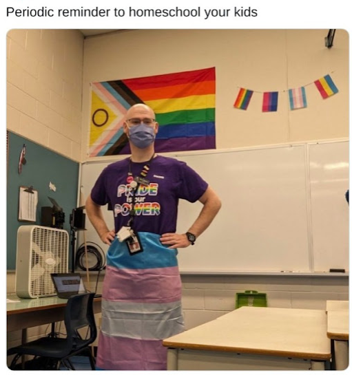 Oicture of gay teacher in classroom.