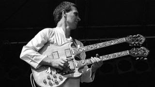 John McLaughlin onstage with Mahavishnu Orchestra