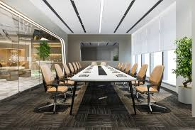 sophisticated boardroom with a long, modern table surrounded by plush leather chairs, flanked by large windows and sleek glass partitions, embodying a professional and polished corporate environment.