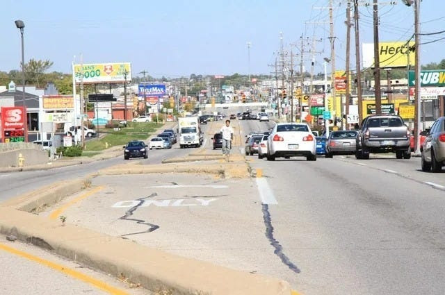 May be an image of 1 person, car, street, road and text that says 'JANS $5000 TiRsMAX Hert UB'
