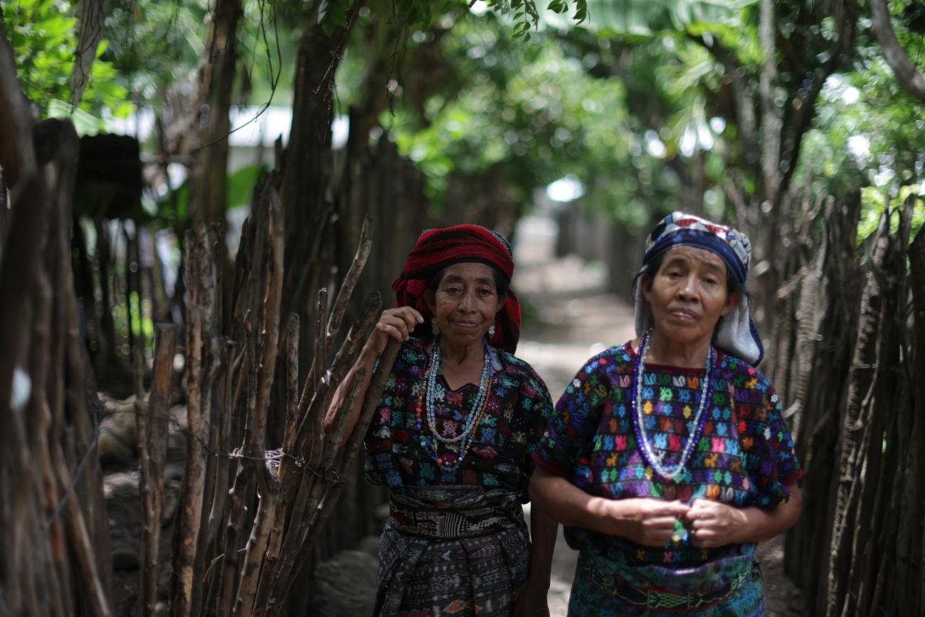 Maria Rosario Gonzales, 64, and Maria Felipe Espartaco, 54, pose for a photo.