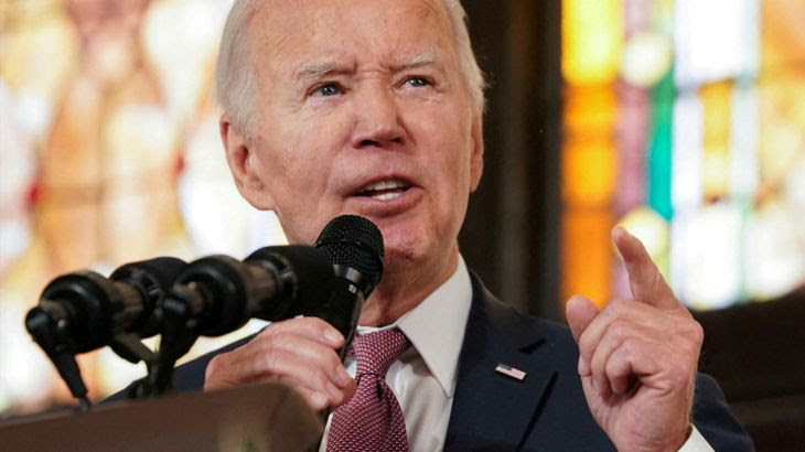 Image of President Joe Biden speaking into a microphone.