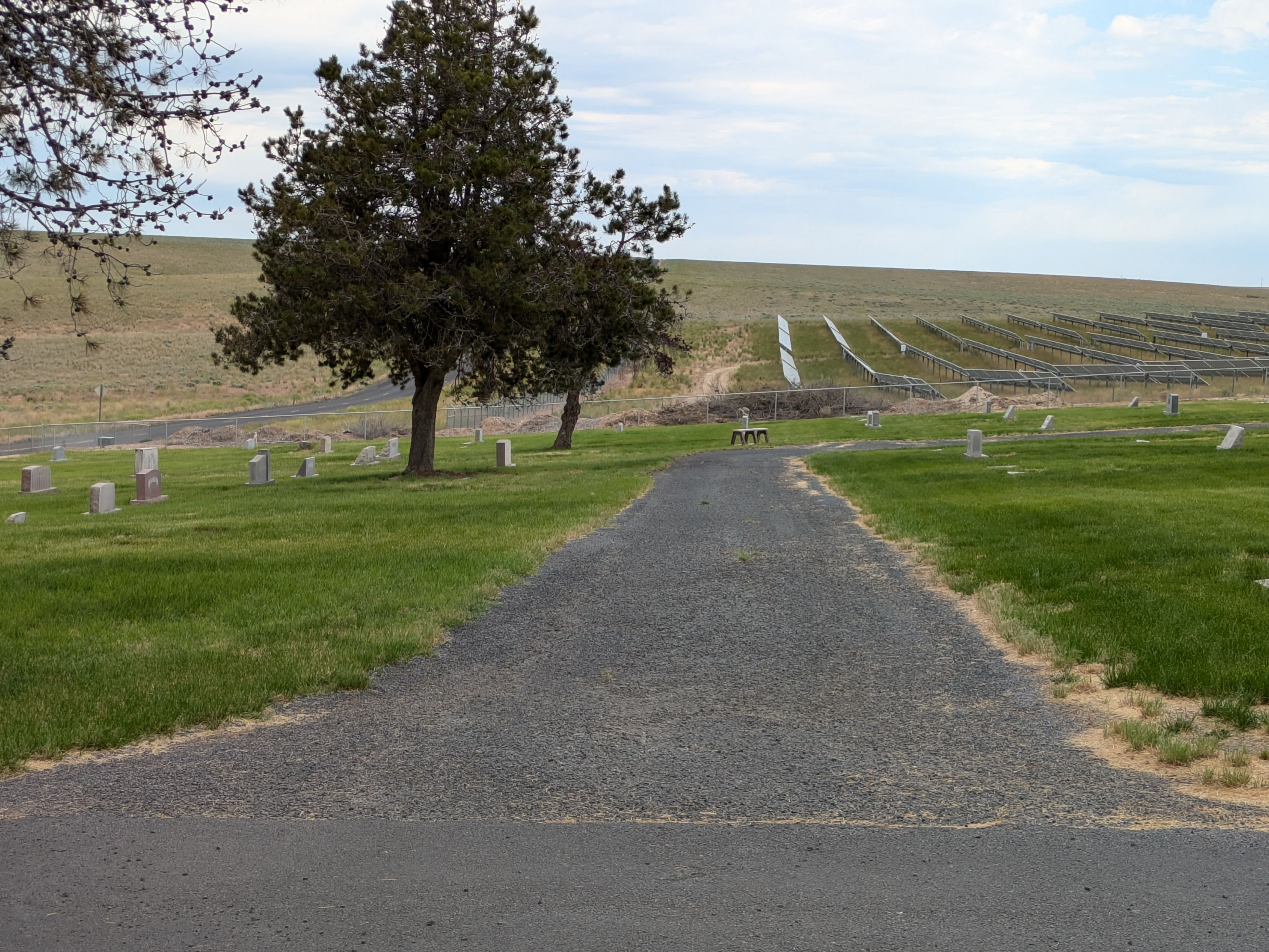 The pre-existing CRP is on the left; panels on right, and cemetery in foreground