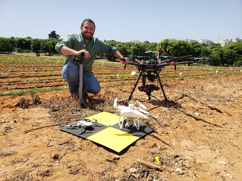 A person holding a droneAI-generated content may be incorrect.