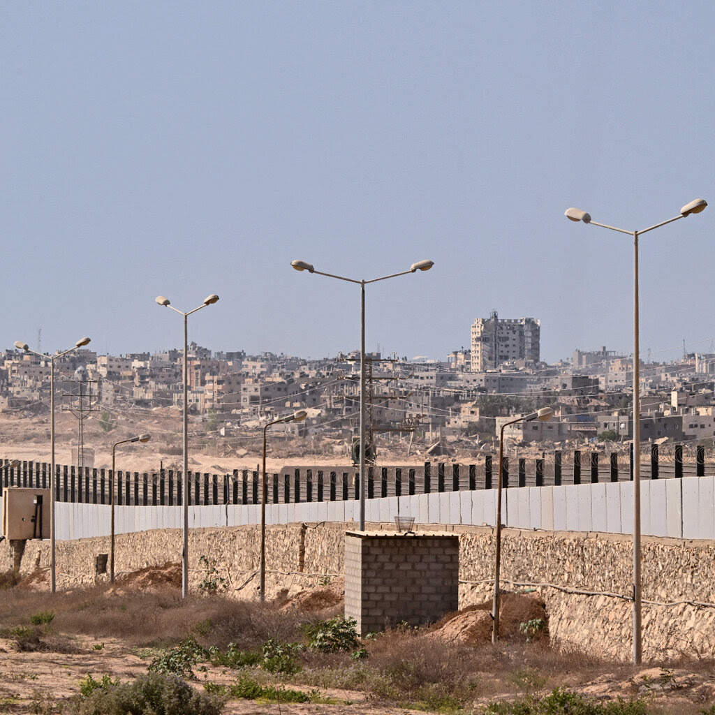 An urban landscape, dominated by a barrier.