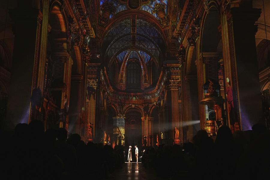 Performers stand at the front of the church of Saint-Sulpice for a performance.