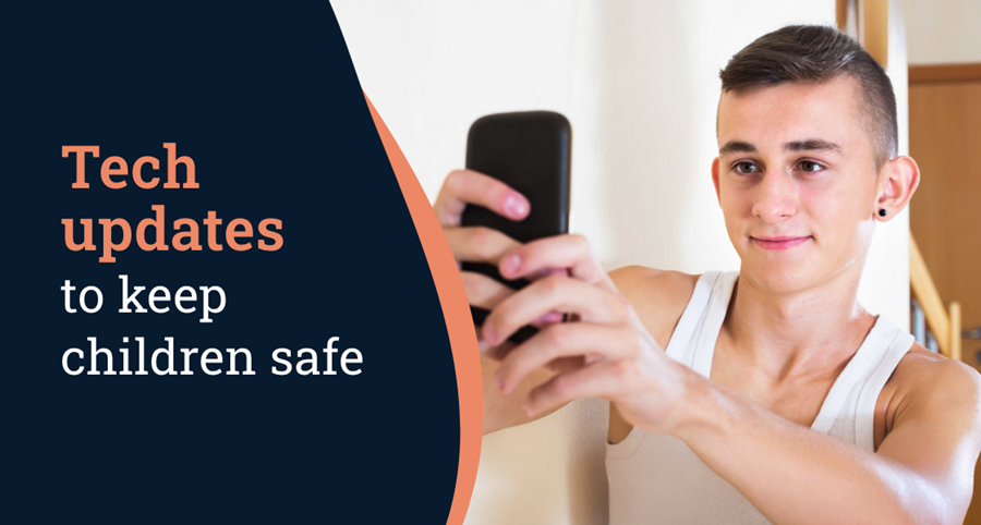 A young man looks at a mobile phone and smiles. Words on the screen read Tech updates to keep children safe.