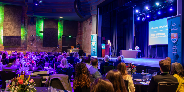 Michigan LCV Executive Director speaking on stage at the Detroit Gala.