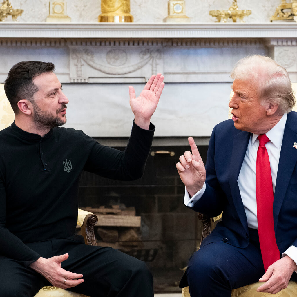 President Trump and Volodymyr Zelensky speaking animatedly in the Oval Office. 