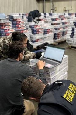 NOAA Enforcement Officer inspects Brazilian import in Newark, NJ.