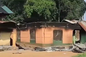 Buildings show significant damage.