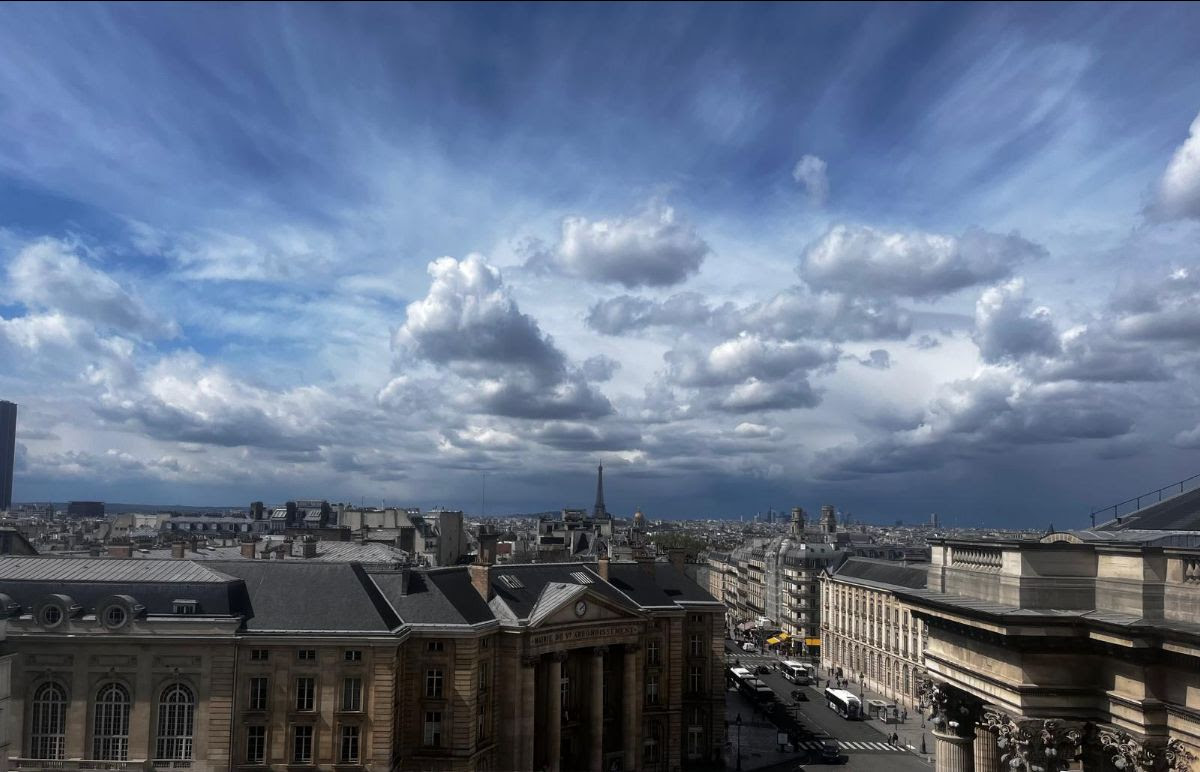 View of a dramatic cloudy sky from the top of the Panthéon in Paris.