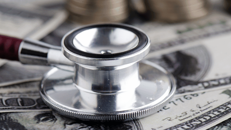 A stethoscope sits on money.