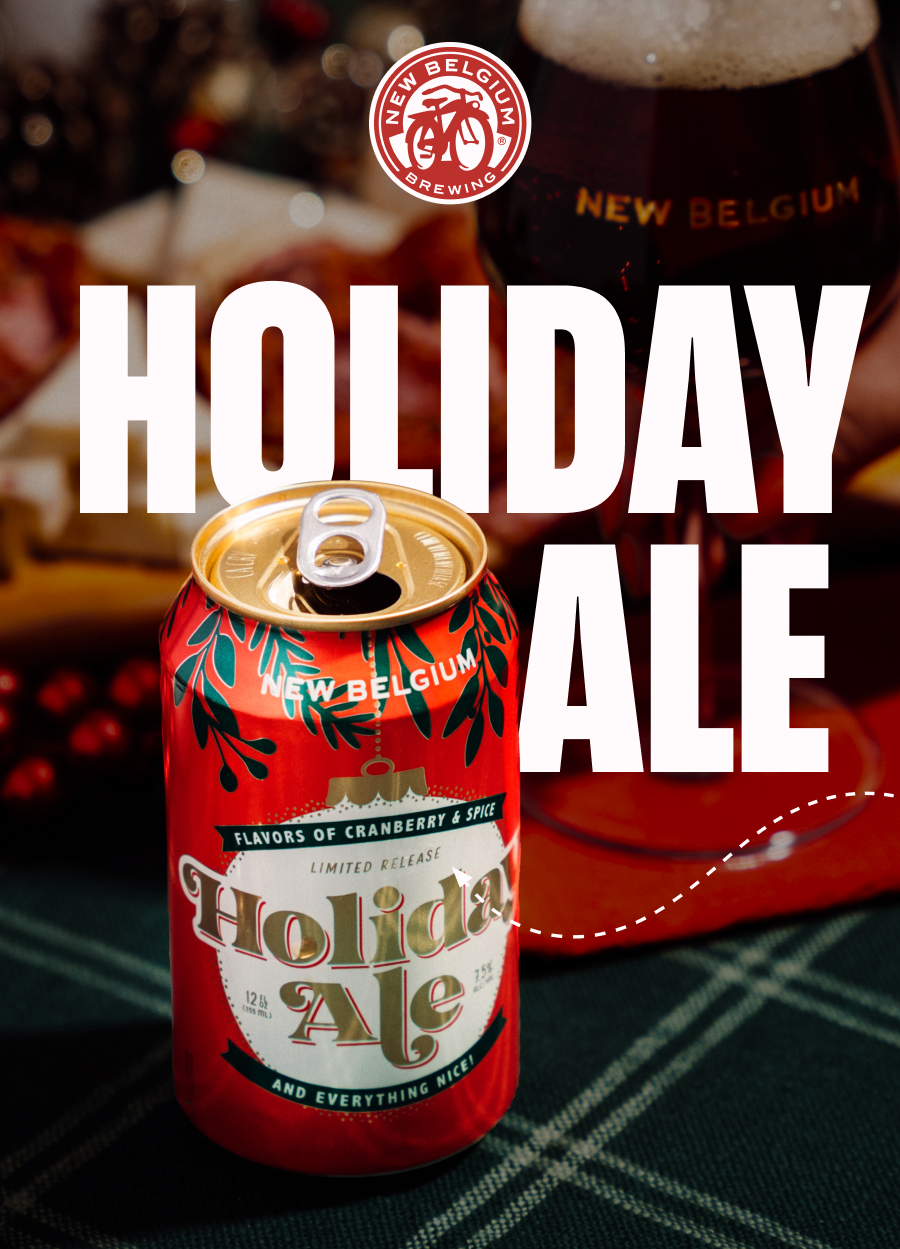 A can of beer featuring the label "CGIUM BELGİL ANEW BREWING NEW BELGIUM HOLIDAY ALE" with illustrations of cranberry flavors. The design includes a holiday theme and indicates it is a limited release. The can is made of aluminum and is positioned indoors.