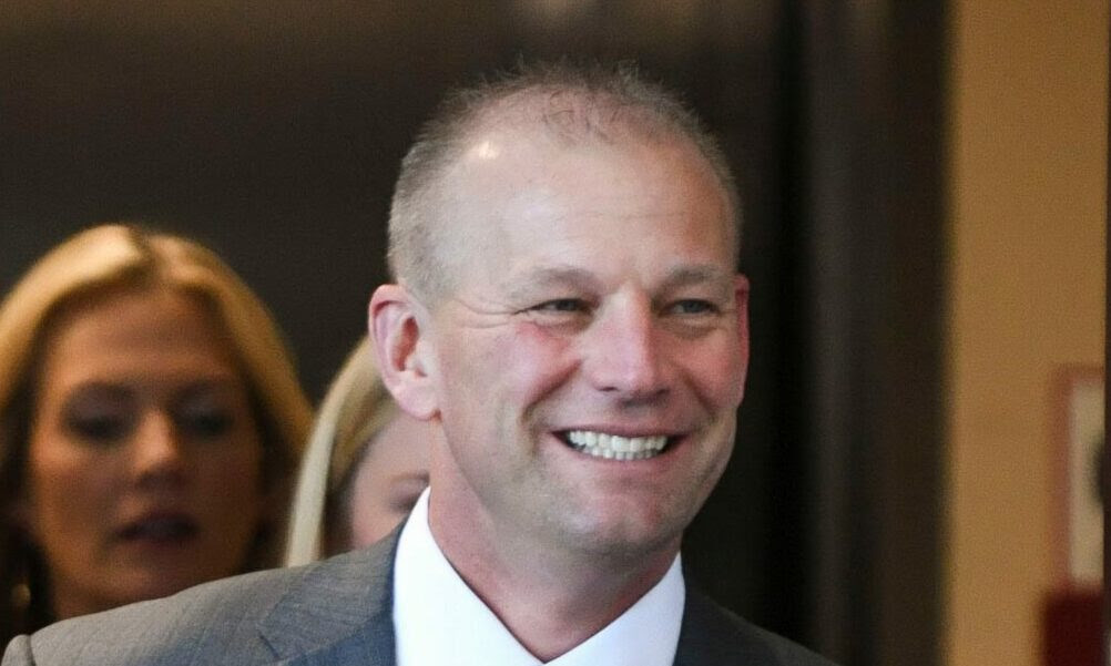 Alabama HC Kalen DeBoer walks into his introductory press conference.