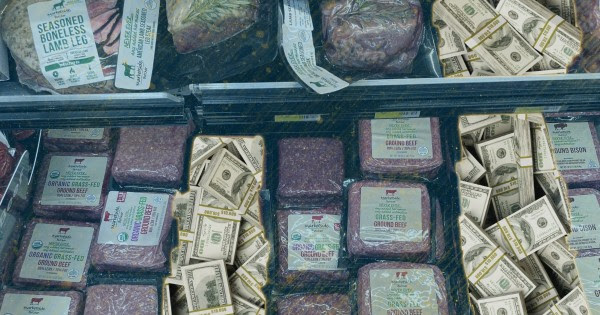 a case of meat at a walmart store with some products replaced with dollar bills