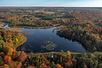 Rugg Pond Dam, a high-hazard dam on the Rapid River that impedes Atlantic salmon and other fish species from accessing 21 miles of upstream habitat. 